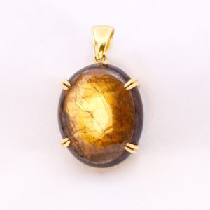 gold sheen sapphire pendant with strong gold aurora effect